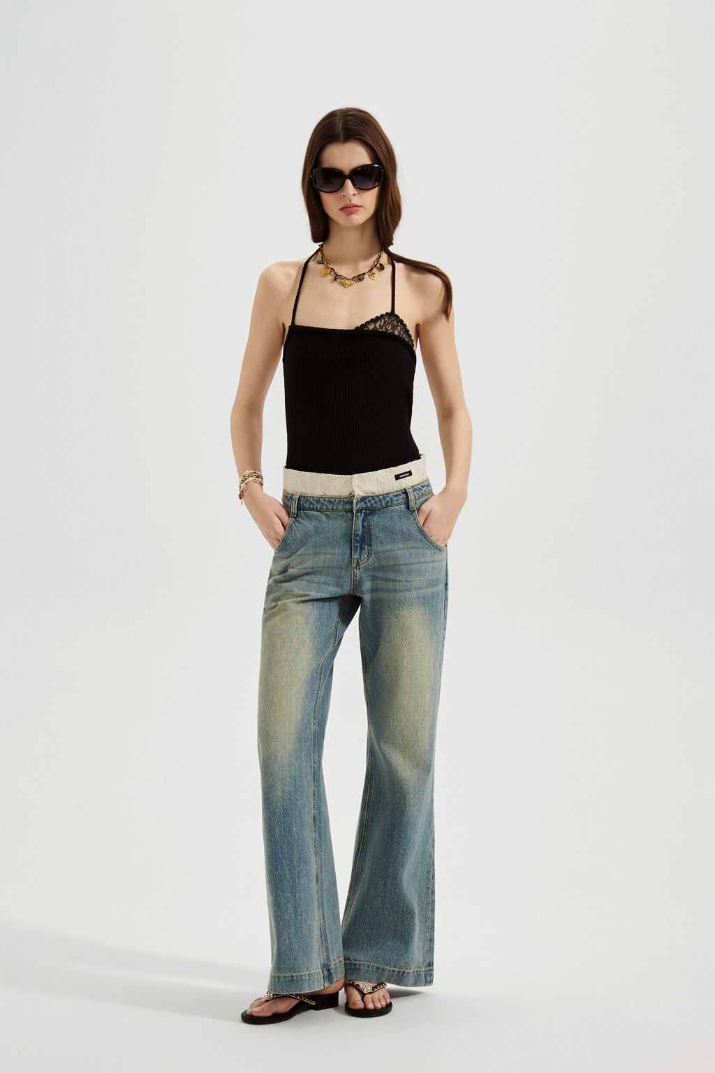 Black halterneck knit top with lace panels