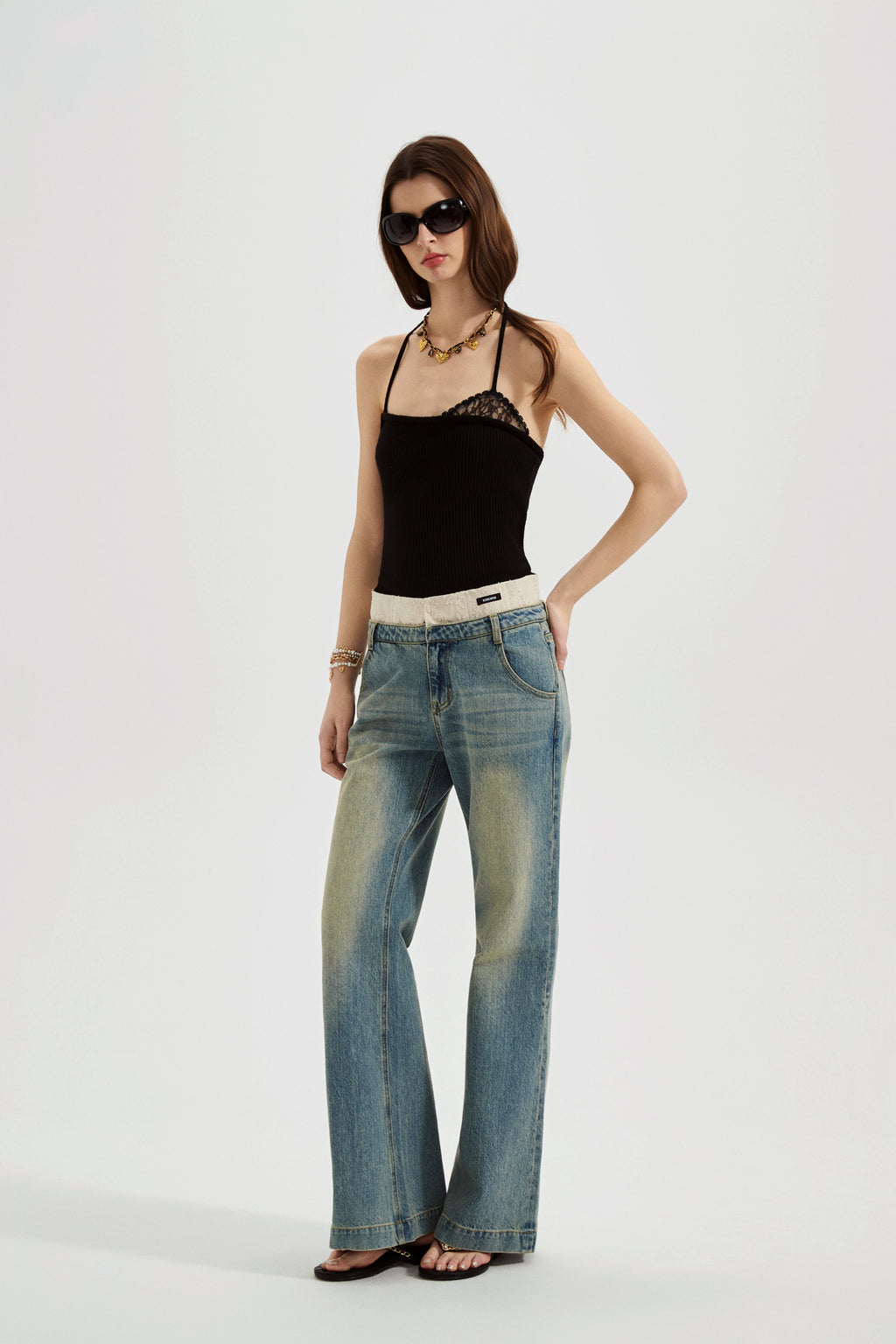 Black halterneck knit top with lace panels