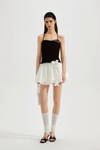 Black halterneck knit top with lace panels