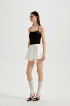 Black halterneck knit top with lace panels