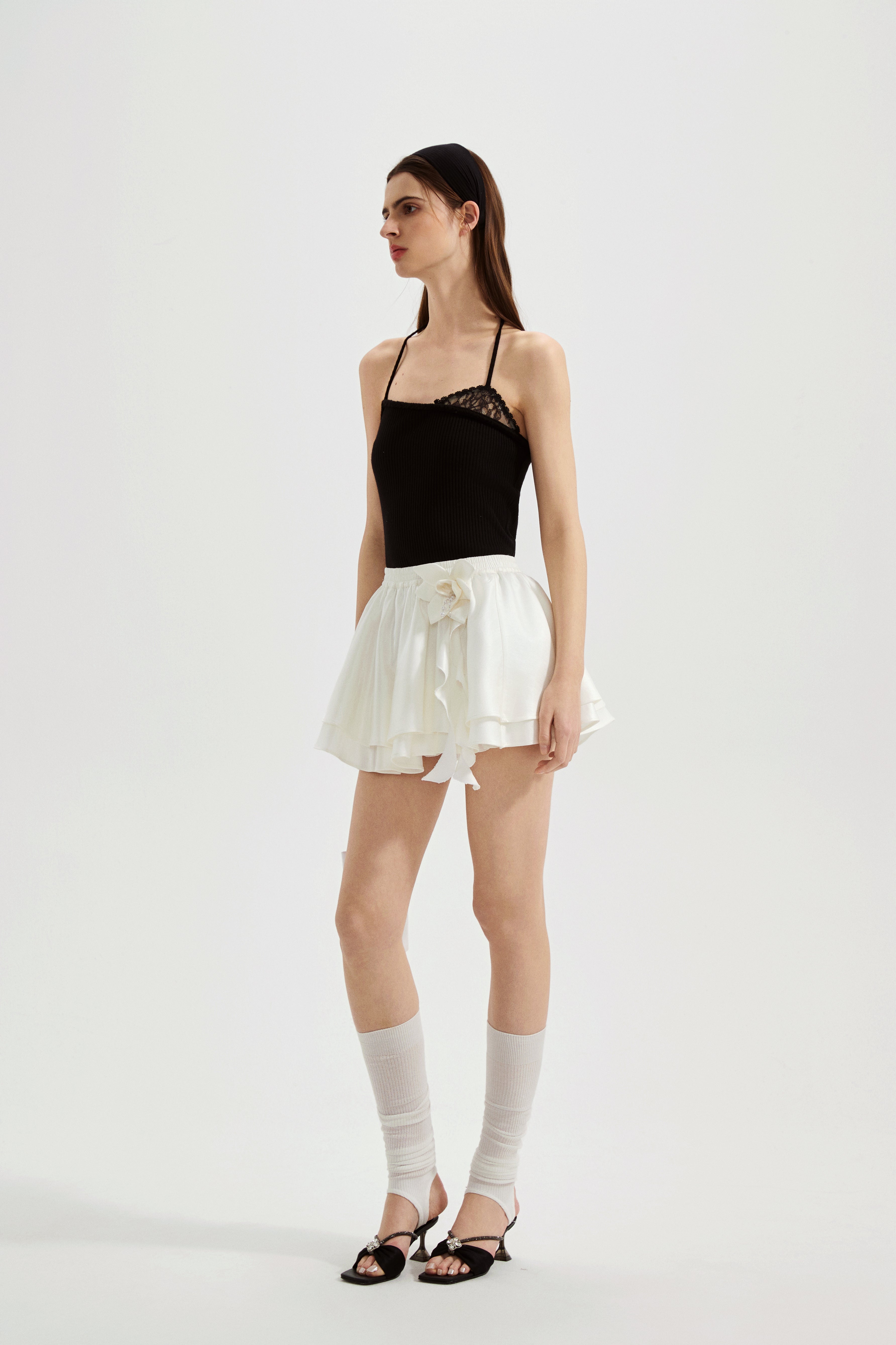 Black halterneck knit top with lace panels