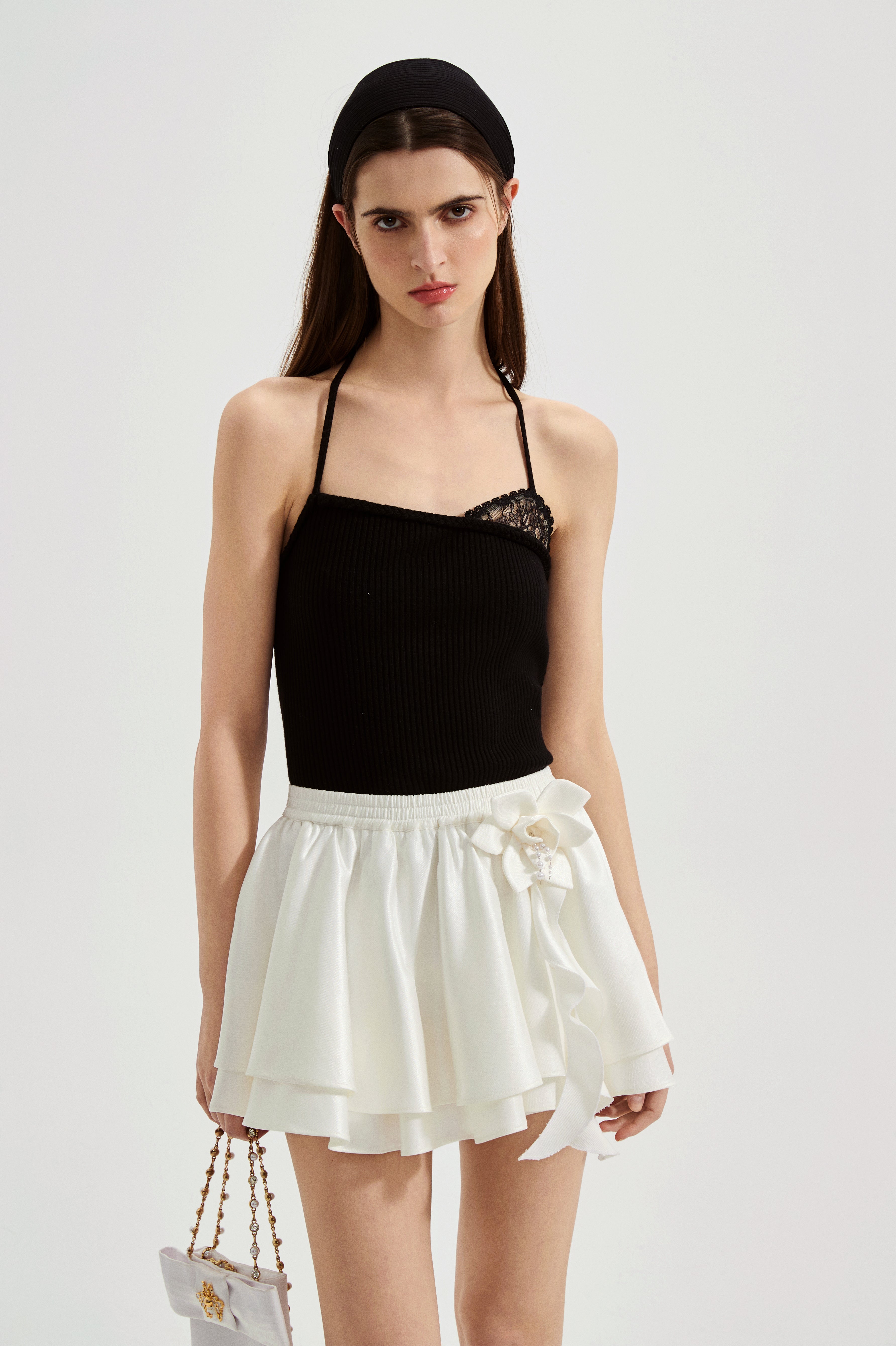 Black halterneck knit top with lace panels