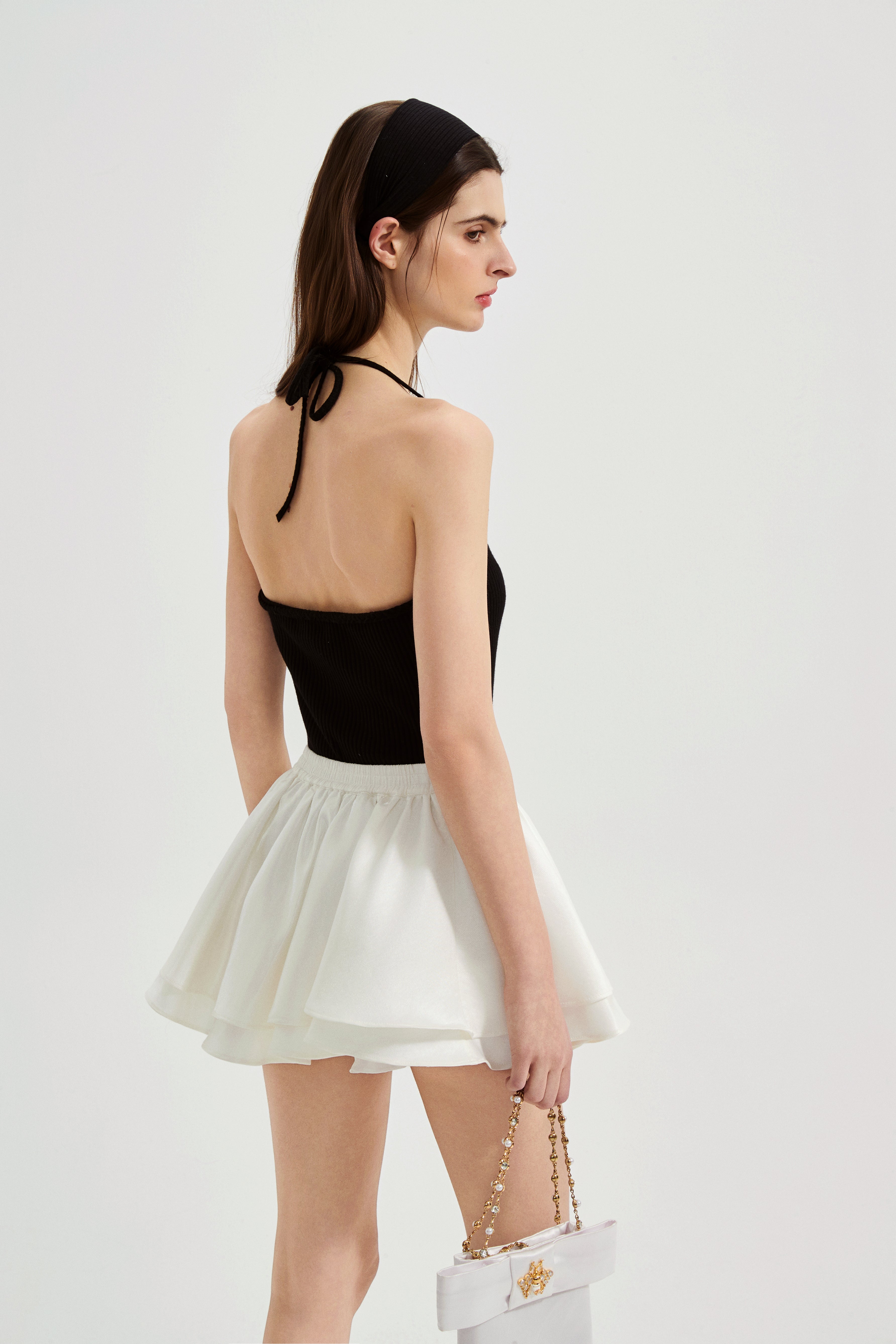 Black halterneck knit top with lace panels