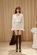 Beige V-Neck Blouse with Belt Buckle & Ruffle Trim