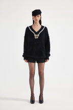 Black Bow Draped Chain Sweater