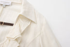 Beige V-Neck Blouse with Belt Buckle & Ruffle Trim