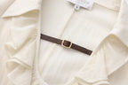 Beige V-Neck Blouse with Belt Buckle & Ruffle Trim