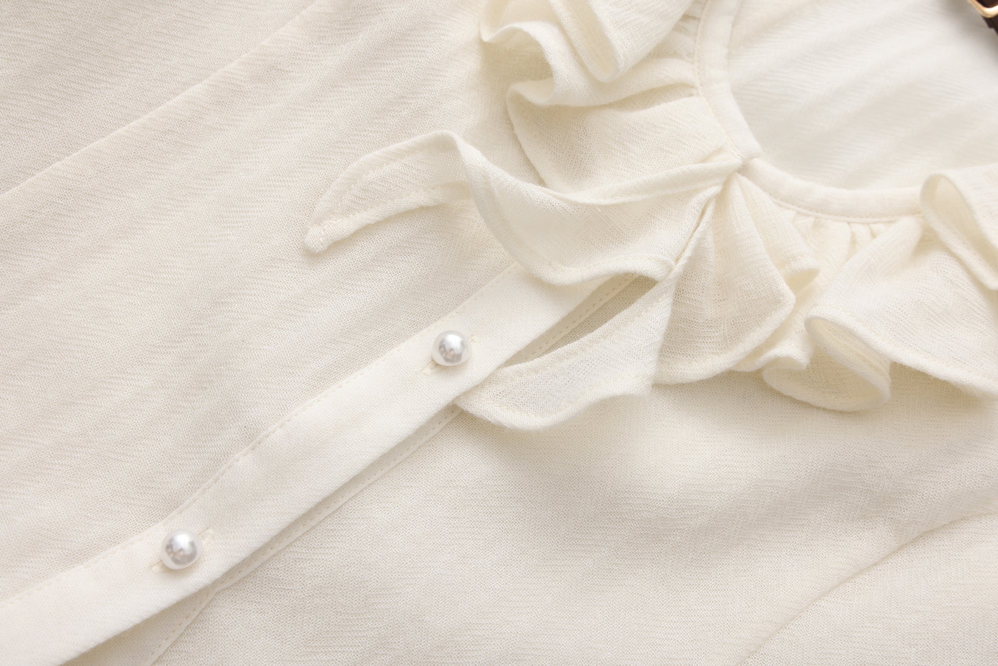 Beige V-Neck Blouse with Belt Buckle & Ruffle Trim