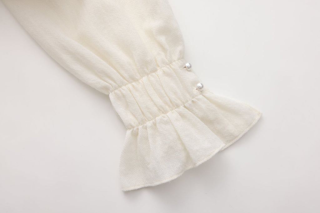 Beige V-Neck Blouse with Belt Buckle & Ruffle Trim