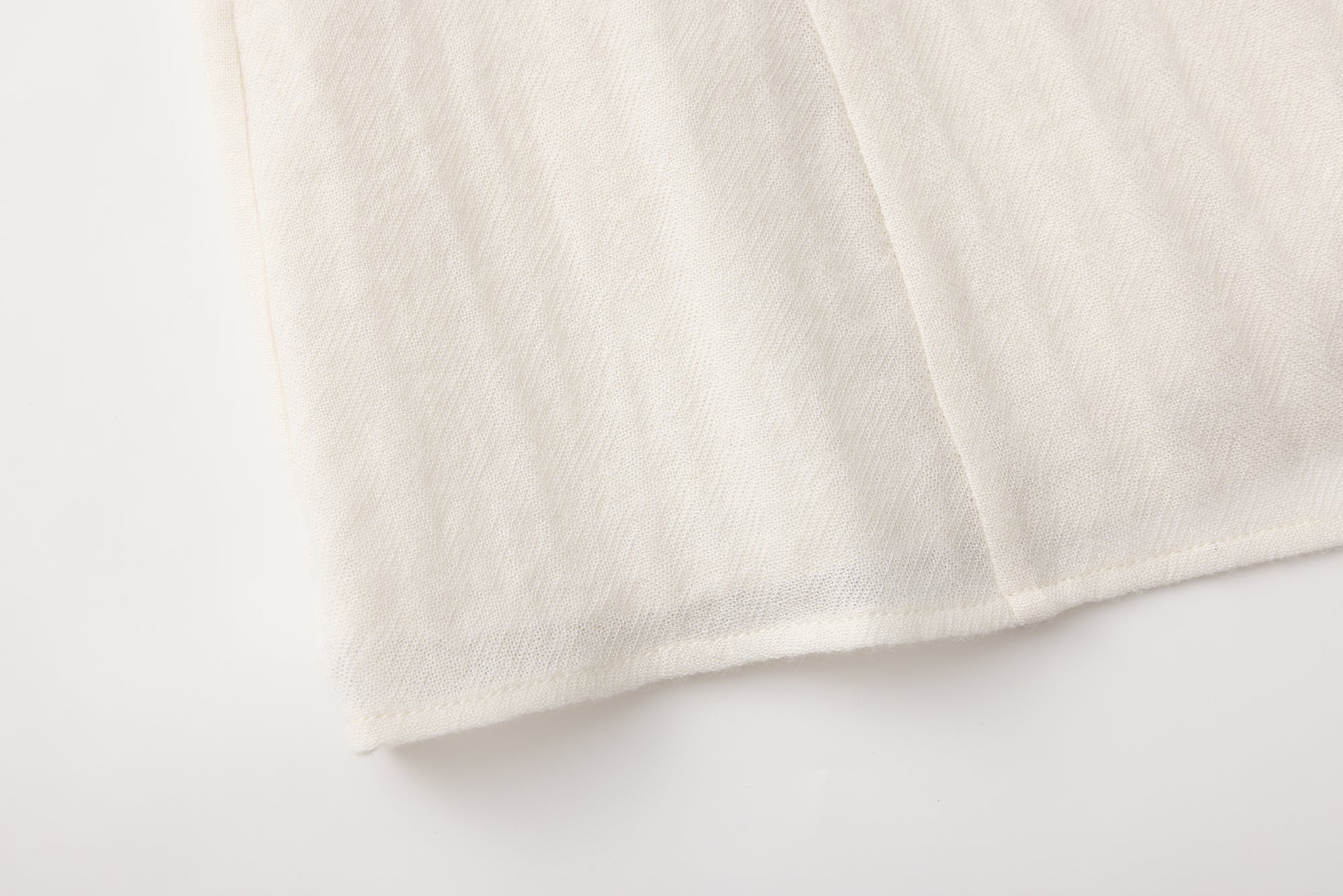 Beige V-Neck Blouse with Belt Buckle & Ruffle Trim