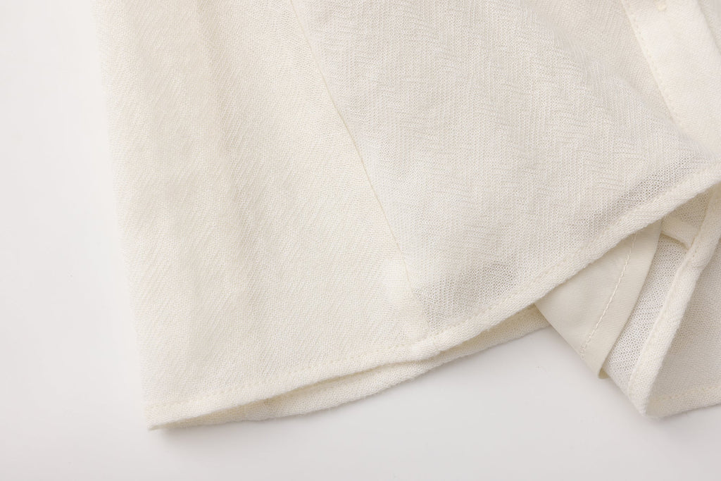 Beige V-Neck Blouse with Belt Buckle & Ruffle Trim
