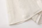 Beige V-Neck Blouse with Belt Buckle & Ruffle Trim