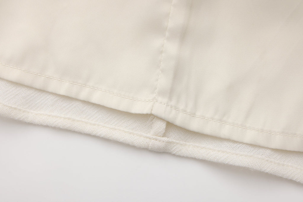 Beige V-Neck Blouse with Belt Buckle & Ruffle Trim