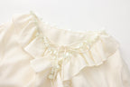 Oversized V-Neck Tie Top with Sequin Ruffle Trim