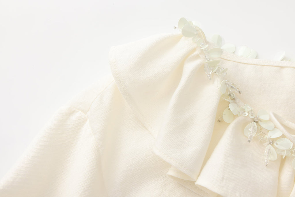 Oversized V-Neck Tie Top with Sequin Ruffle Trim