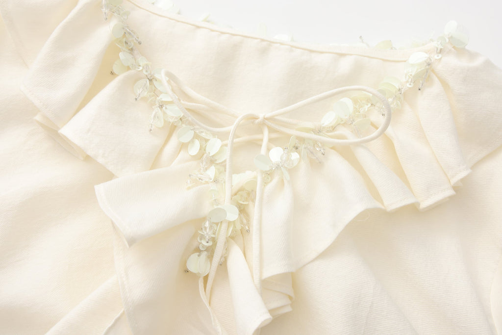 Oversized V-Neck Tie Top with Sequin Ruffle Trim