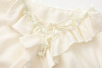 Oversized V-Neck Tie Top with Sequin Ruffle Trim