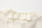 Oversized V-Neck Tie Top with Sequin Ruffle Trim