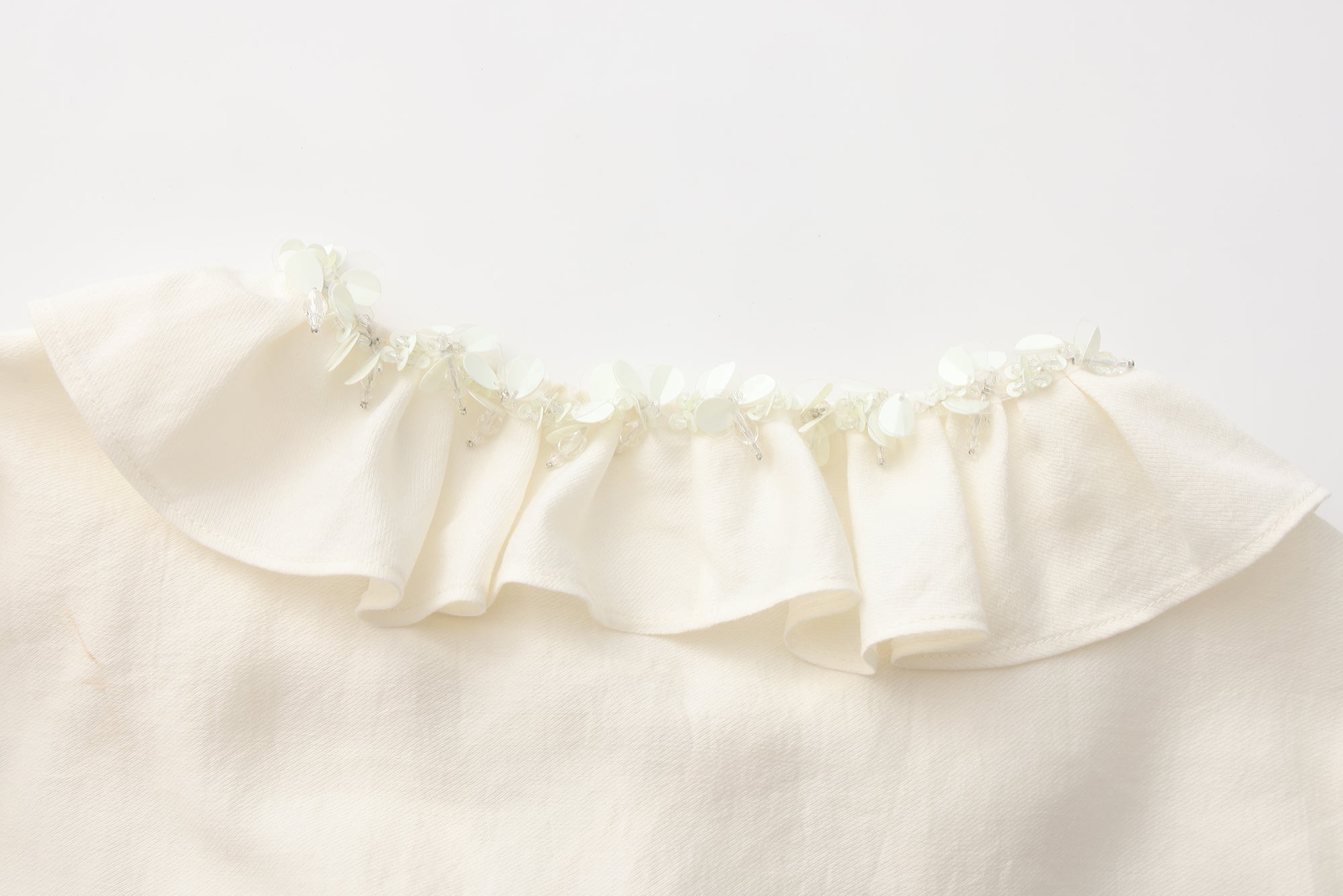 Oversized V-Neck Tie Top with Sequin Ruffle Trim